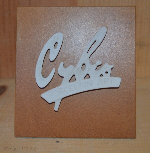 Cybis dealer sign 1960s signature on light wood
