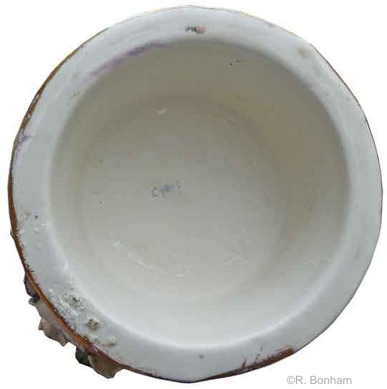 female handle mug with teal leaves and gilt accents signature